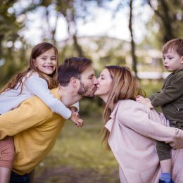 Family is the greatest blessing you can ever have. Parents spending time with their children outside.